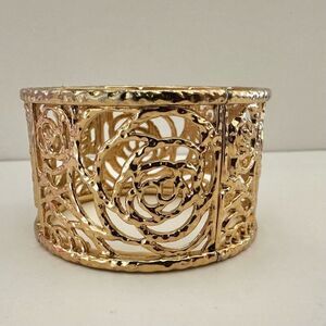 Gold tone wide bangle bracelet